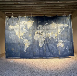 Ryts Monet, World Map (on sustainable fashion), 2021, laser processing, pumice stone, sandpaper, pigments (Recycrom), on denim (Candiani), ca. 500 x 300 cm