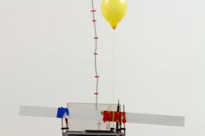 5) Battiato, La voce del padrone, electrical cables, speakers, helium, wire, turntable, rasp, clamps, adhesive tape, baloon, ruler, Rizzo's chair, timer, fans, Roberto de Pol, 2013