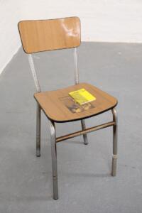 Andrea Mastrovito, Il Critico come Artista, 2016, monete, libro e matita su sedia, 87 x 39 x 40 cm